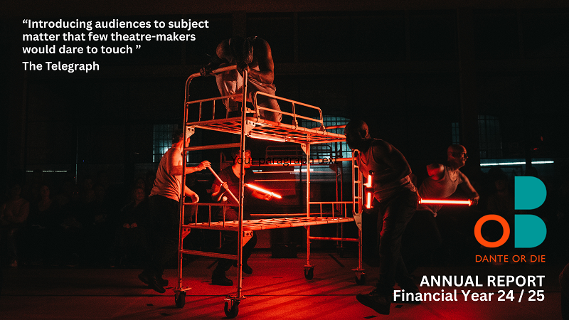 Prison bunkbed with actor crouched down on top bunk, illuminated in red lighting